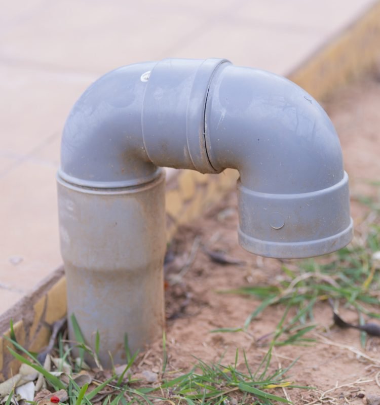 gray-pipe-connector-on-brown-dirt-and-grass-2026-01-09-14-28-56-utc